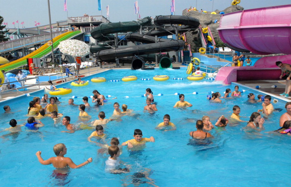 The pools were filled with swimmers at Splashtown USA Thursday. The park is adding two seven-story w...